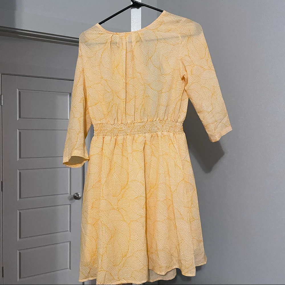 Light yellow summer dress with open back